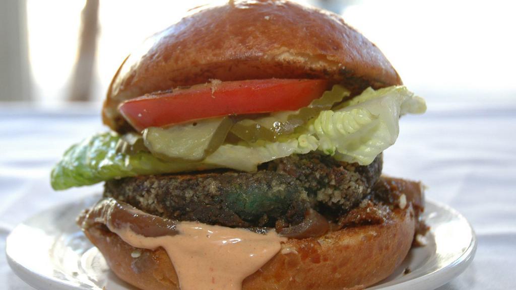 The Sydney Burger · Our vegetarian burger with a plant based patty, caramelized red onions, chipotle remoulade, lettuce, tomatoes, and pickles.