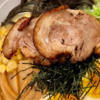 Tonkotsu Ramen · Rich Tonkotsu Broth, Braised Pork Belly, Seasoned Soft Boiled Egg, Sliced Green Onions, Mari...