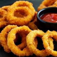 Onion Rings · Cross sectional rings of onion dipped in batter and the deep fried.