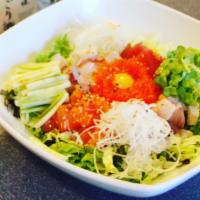hae-dup-bob · spicy sashimi donburi with assorted sashimi cubes and salad over rice, served with spicy sau...