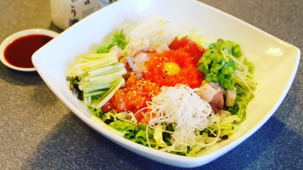 hae-dup-bob · spicy sashimi donburi with assorted sashimi cubes and salad over rice, served with spicy sauce on side