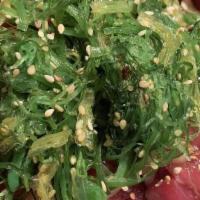 Poki Salad · Hawaiian style ahi, onion, seaweed salad.