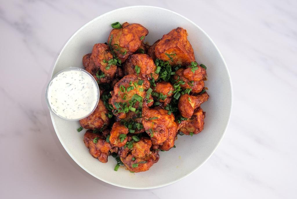 Sweet & Sour Cauliflower Wings · Gluten-free, vegan cauliflower wings tossed in our sweet and sour sauce and served with housemade vegan ranch dressing.