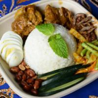 2. Nasi Lemak · Chicken rendang served with coconut rice, crispy sambal anchovies, toasted peanuts, cucumber...