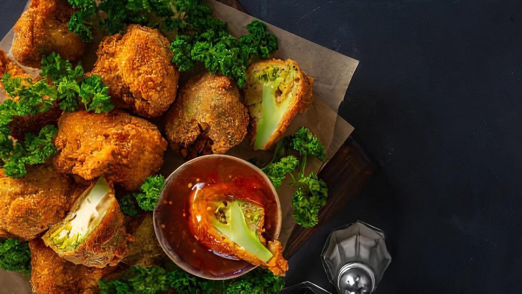 Crispy Chicken with Broccoli · Deep fried crispy chicken, garlic, ginger and sweet chili sauce, topped with broccoli.