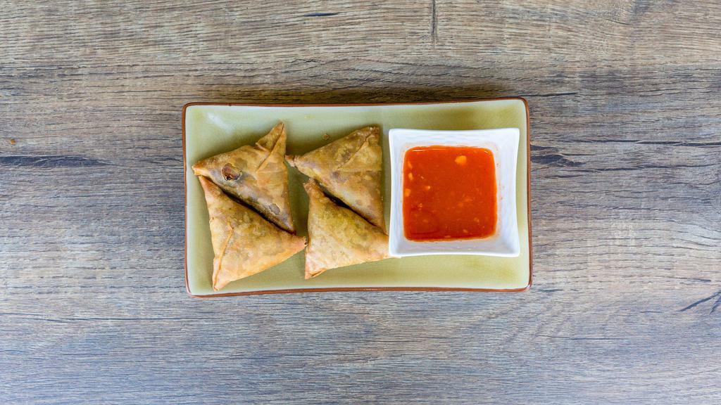 Samosa · Wheat flour wrap filled with potatoes, garlic, red onions, peas, unique spices, served with our special house sauce.