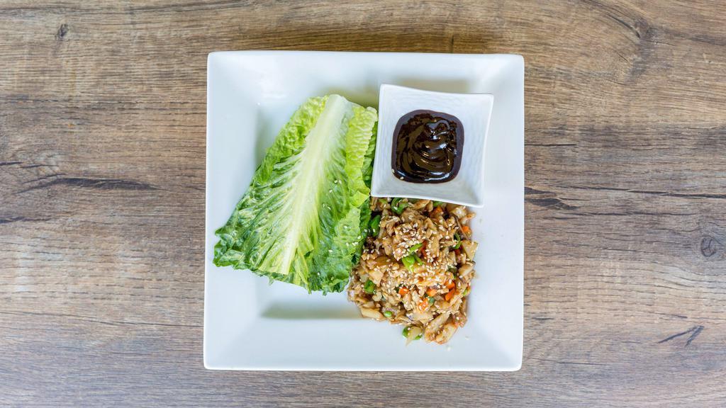 Lettuce Wrap · Gluten free available. Choice of tofu, chicken or shrimps wrapped in romaine lettuce with carrots, mushrooms, snap peas, radish, ginger, garlic, water chestnuts, cooked with hoisin sauce, sesame seeds on top.