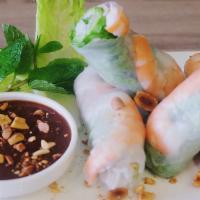 A2. Spring Rolls · Pork n shrimp fresh rolls wrapped with lettuce, mint and vermicelli. Served with peanut butt...