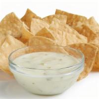 Chips & Queso (Regular) · Signature creamy Queso Blanco served with fresh house-made tortilla chips.