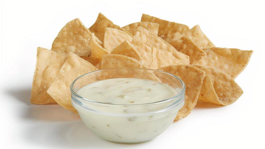 Chips & Queso (Regular) · Signature creamy Queso Blanco served with fresh house-made tortilla chips.