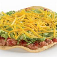 Crunchtada® Tostada · The original Crunchtada®! A thick, wavy, crunchy corn shell layered with slow-cooked beans m...