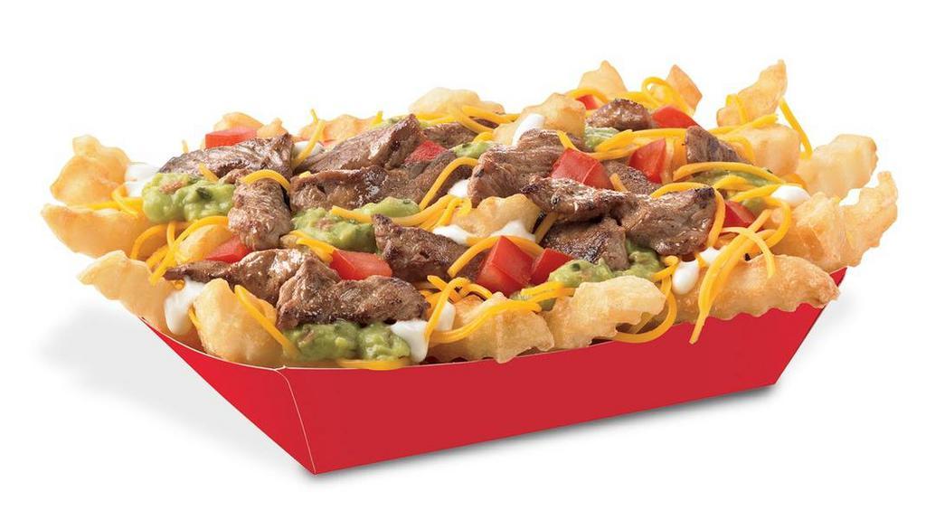 Carne Asada Fries · Crinkle Cut Fries topped with freshly grilled carne asada, freshly grated cheddar cheese, savory secret sauce, fresh house-made guacamole, and fresh diced tomatoes.