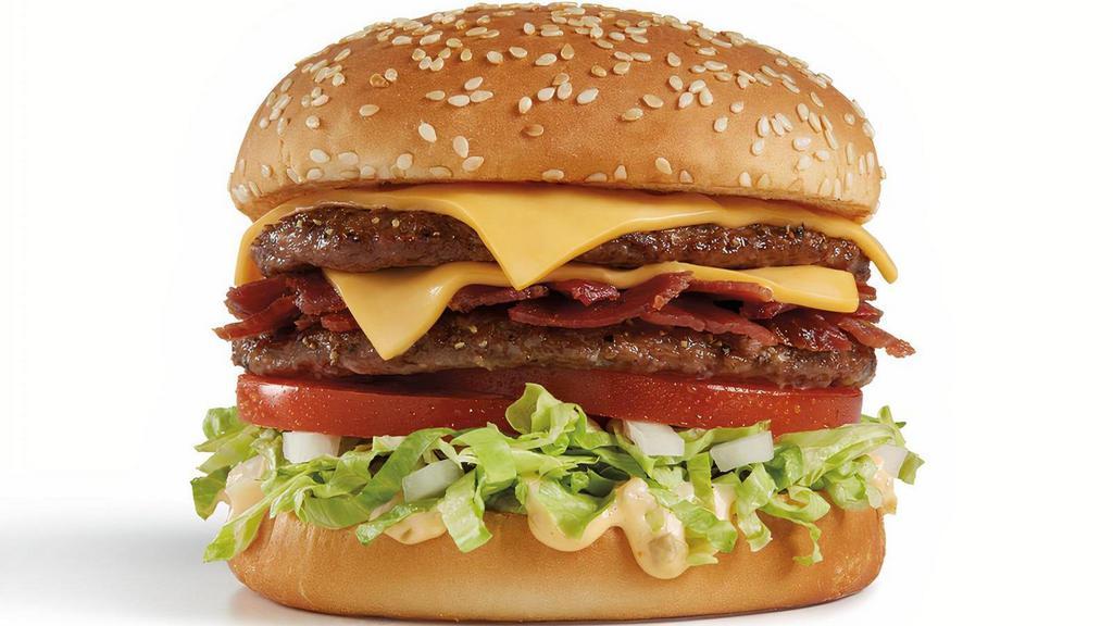 Bacon Double Del® Cheeseburger · Two 100% beef patties grilled to order, crispy bacon, two slices of American cheese, two fresh tomato slices, burger sauce, crisp shredded lettuce, and diced onions on a grilled sesame seed bun.