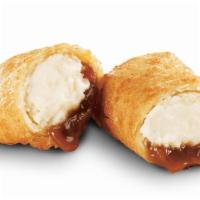 Caramel Cheesecake Bites · Piping hot bundles of sweet cheesecake and gooey caramel, enveloped in a light crispy shell....