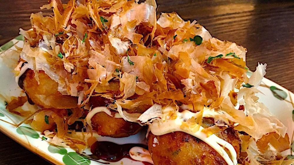 11. Takoyaki (Octopus Balls) · Pancake like balls with octopus, topped with tangy sauce, mayonnaise and bonito flakes. 6 pieces.