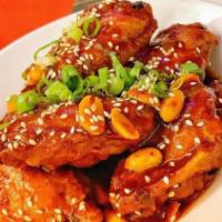 3. Korean Fried Chicken Wings with Sweet & Sour Spicy Sauce. · Battered and deep fried chicken wings tossed in sweet and spicy Korean sauce. Contains peanu...