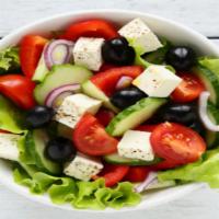 Greek Salad · Fresh greens, tossed with onions, cucumbers, and tomatoes topped with feta cheese and herb c...