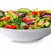 Green Salad · Creamy avocado, cucumbers, tomatoes, and onions over a bed of fresh greens with a side of ho...