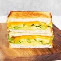 Avocado Melt · Griddled sandwich with avocado, melted yellow cheddar cheese, garlic aioli, and your choice ...
