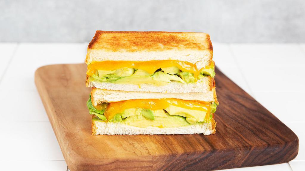 Avocado Melt · Griddled sandwich with avocado, melted yellow cheddar cheese, garlic aioli, and your choice of bread.
