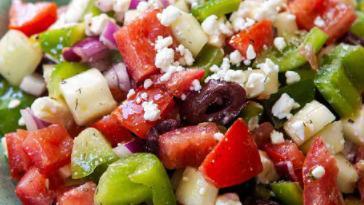 Greek Salad · Greek salad with feta cheese, olives, tomato, cucumber, and a side of viniagrette.