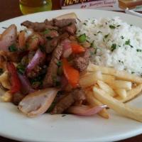 Lomo Saltado · Sautéed beef with tomatoes, red onions soy sauce & steam rice.