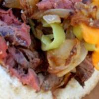 BBQ Philly Cheese Sandwich · Thinly sliced steak or chicken drizzled BBQ sauce smothered in white American cheese and pil...