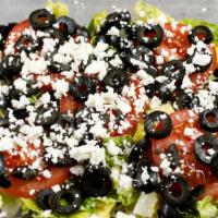 Greek Salad · Vegetarian. Feta cheese, crisp romaine lettuce, tomatoes, black olives and cucumbers.