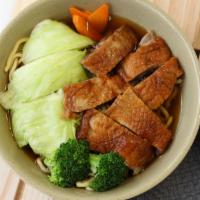 11. Roast Duck Noodle Soup · Savory light broth with noodles.