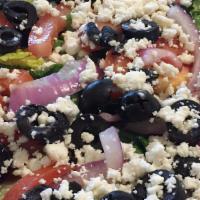 Greek Salad · Crispy lettuce, feta cheese, black olives, tomatoes, and red onions.