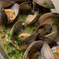 Steamed Clams · Manila clams in a buttery white wine garlic sauce served with crostini.