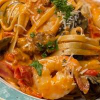Fettuccine Jambalaya · clams, mussels, shrimp, roasted red bell peppers, italian sausage in light spicy cream tomat...