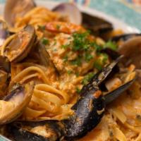 Fettuccine Fruiti di Mare · clams, mussels, shrimp, scallops in a light tomato cream sauce.