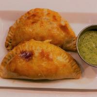 Empanada · A (2) pastry stuffed with seasoned ground beef & Cheese served with avocado cream sauce
