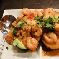 Relleno Nuevo · Shrimp sautéed with tomatoes, onions and cilantro in a creamy chipotle sauce, served on top ...