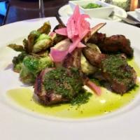 Rack of Lamb Churrasco · Tender Australian lamb grilled to your request drizzled with chimichurri sauce, served  with...