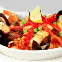 Arroz con Mariscos · Spiced rice, diced chicken breast, chicken chorizo, mussels & tiger shrimp with sweet green ...