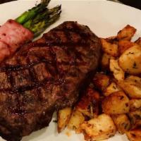 Argentinian Grilled 10-oz Steak · Grilled center cut Certified Angus Beef® strip steak with herbed butter, and served with mas...