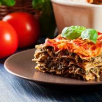 Penne Lasagna · Oven baked penne pasta flavored with marinara sauce and vegetables. Served with customers ch...