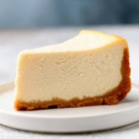 New York Cheesecake · Classic creamy cheesecake filling baked in a housemade buttery crust.