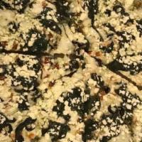 Greek Pizza · Pesto Sauce, Black Olives, White Onion, Spinach and sprinkled with Feta Cheese.