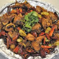 Chong Qing style chicken with chilli pepper  重慶辣子雞 · Spicy. Chicken with bone.