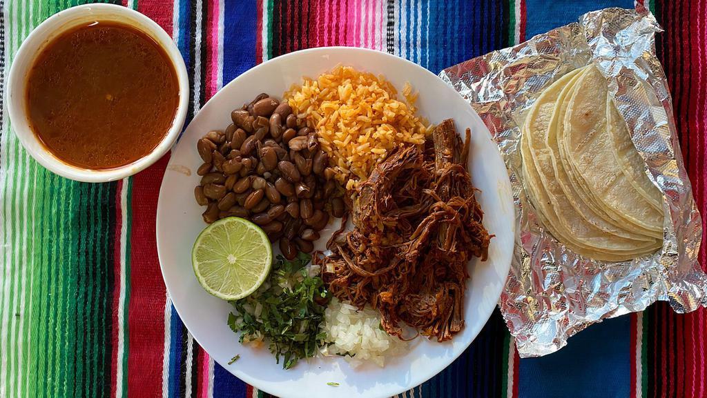 Barbacoa De Res · 1/2 lb of barbacoa, with a side of rice and beans and consome on the side.