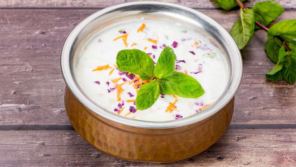 Raita · Our fresh homemade yogurt with shredded cucumbers, fresh tomatoes and selected spices.