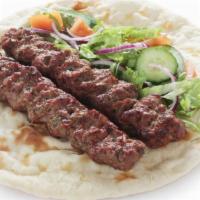 Chicken And Beef Seekh Kabob Wrap · Fresh wrap made with Chicken & Beef kabobs, lettuce, tomatoes, and onion. Served in an India...