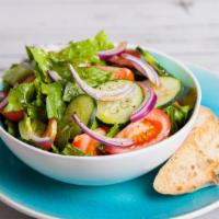 Garden Salad · Fresh salad made with fresh cut lettuce, tomato, cucumber, onion, mixed greens and salad dre...