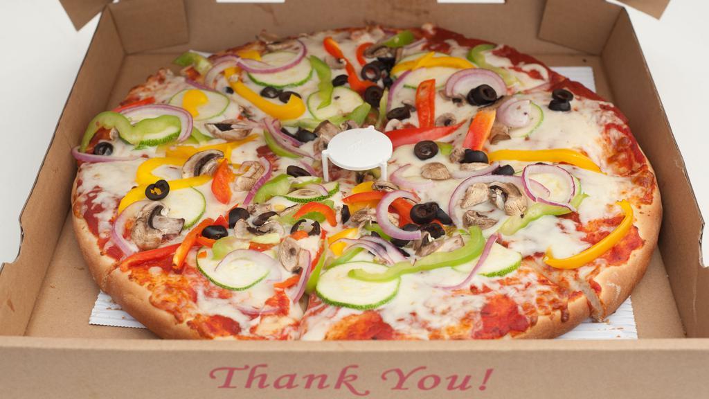 Veggie Pizza · Bell peppers, zucchini, black olives, mushrooms, red onion.
Dairy.  Cholov Ysroel NOT available at the moment!