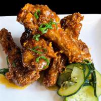 Crispy Duck Wings · Choice of our signature sweet & spicy rub or l'orange sauce, served with bread & butter pick...