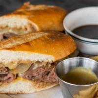 French Dip · Roasted Beef, Swiss cheese, Carmelized onions, Au Jus, French Roll