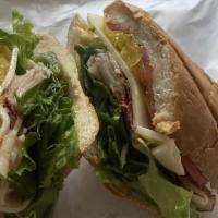 Great Garlic · Pan roasted turkey, bacon, garlic mayo, provolone, pepperoncini, tomato, and lettuce on a fr...